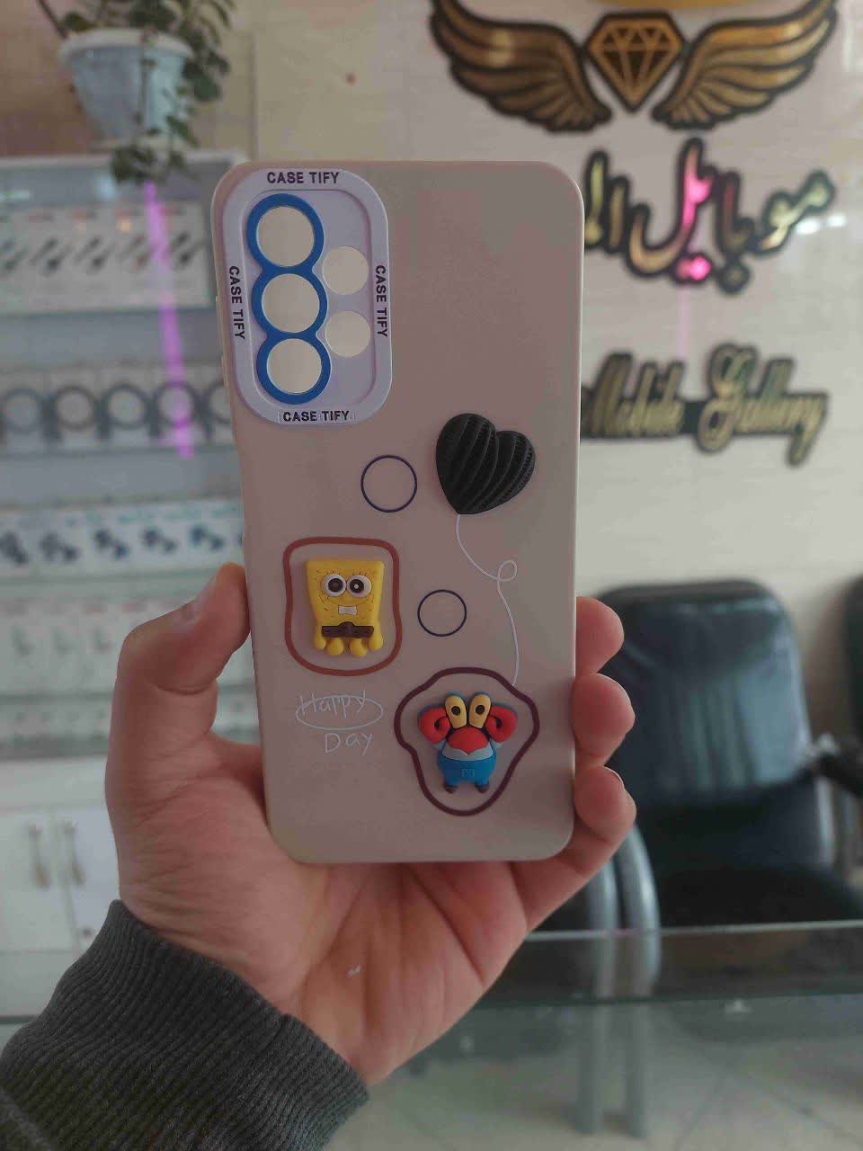 قاب گوشی سیلیکونی عروسک برجسته رنگ کرم مخصوص سامسونگ A13